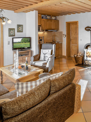 Ferienwohnung Riederin - Wohnzimmer mit Kaminofen